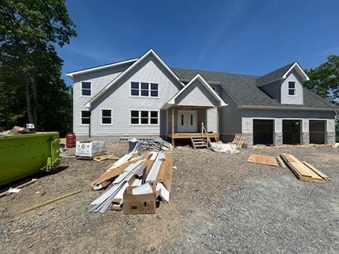 New home construction with completed siding and roofing